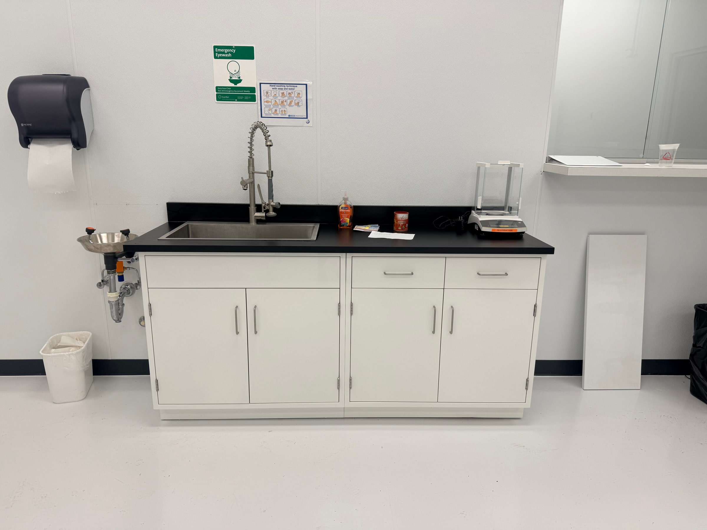Commercial sink and eyewash cabinetry installation in a Bradenton facility