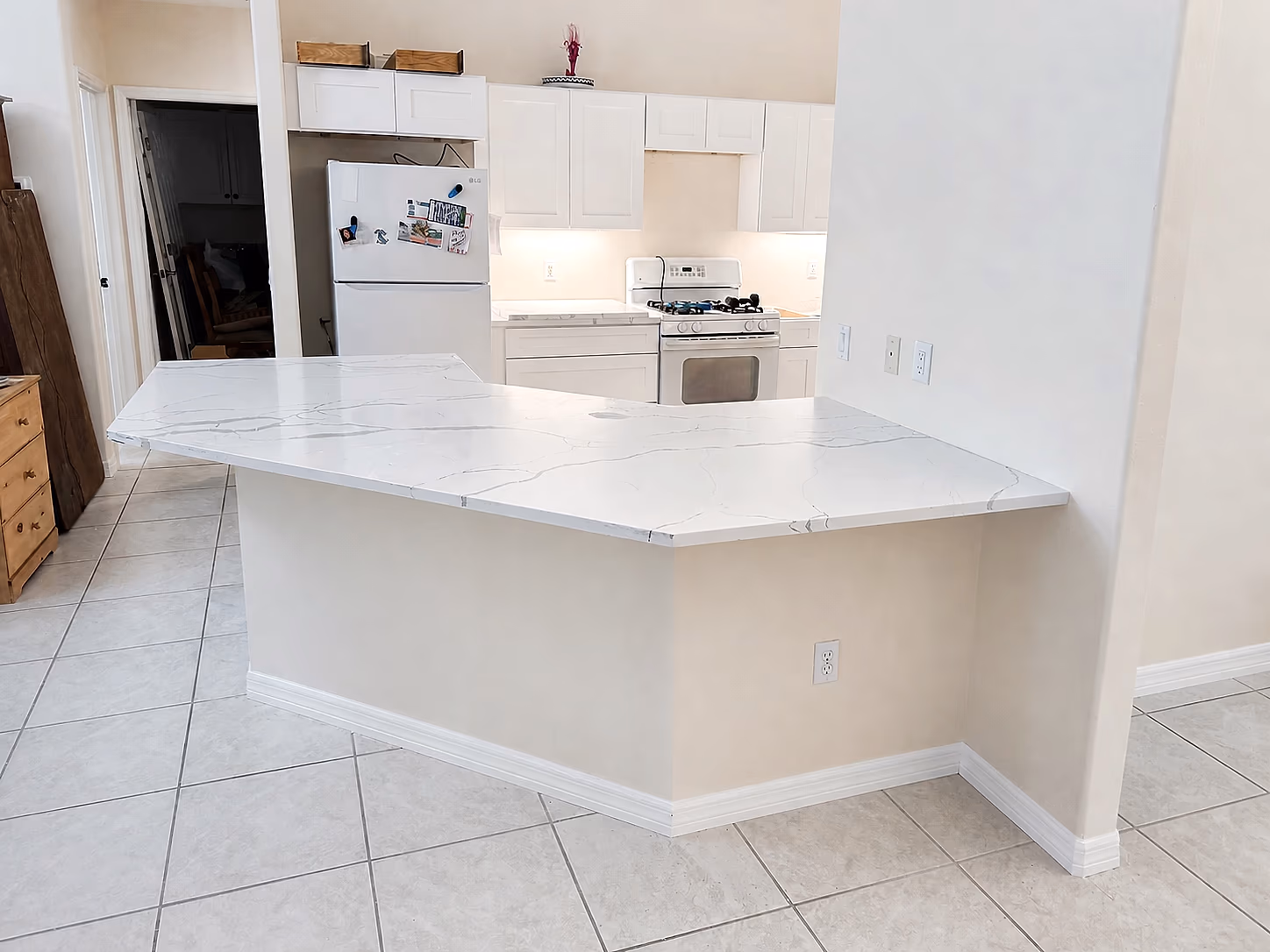 New quartz peninsula installed during a Bradenton kitchen restoration