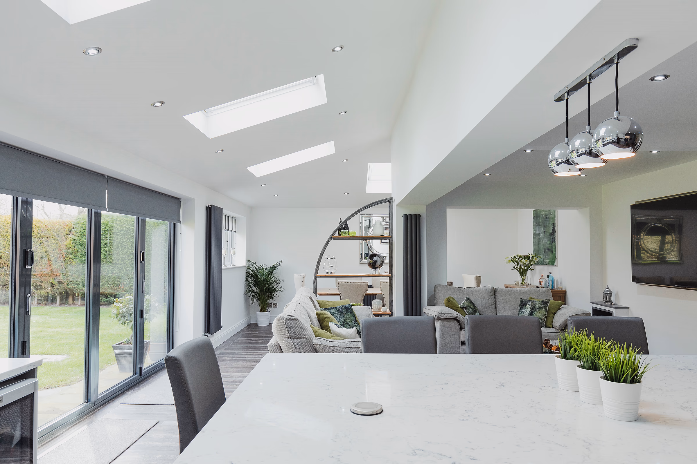 Connected whole-home interior with coordinated living and dining spaces